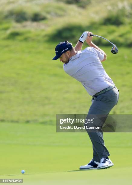 Richie Ramsay of Scotland plays his second shot on the second hole during the first round on day one of the Abu Dhabi HSBC Championship at Yas Links...