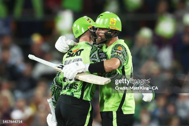 Matthew Gilkes and Alex Ross of the Thunder celebrate victory during the Men's Big Bash League match between the Sydney Thunder and the Melbourne...