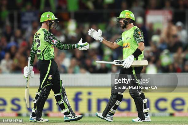 Matthew Gilkes and Alex Ross of the Thunder celebrate victory during the Men's Big Bash League match between the Sydney Thunder and the Melbourne...