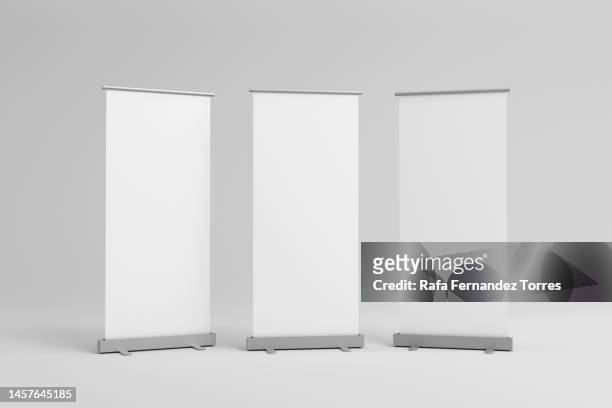 set of blank roll-up, pop-up or pull-up banner stands. 3d render - stand exposition imagens e fotografias de stock