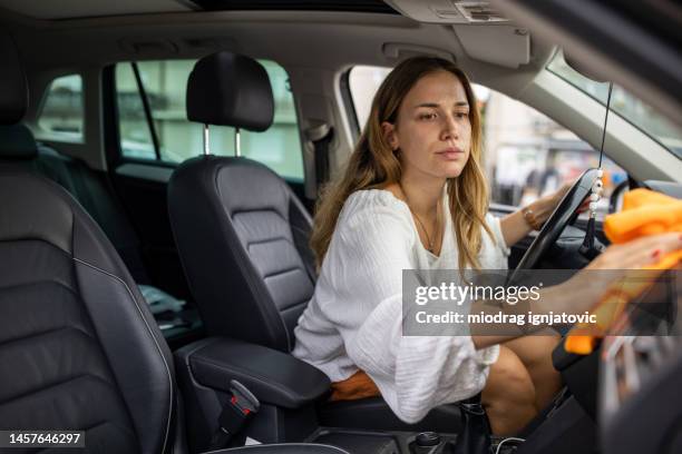 woman cleaning car interior - cleaning inside of car stock pictures, royalty-free photos & images