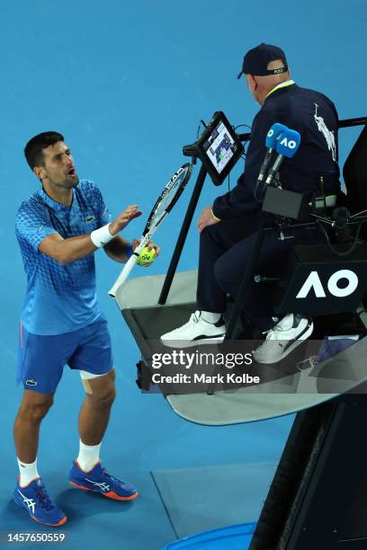 Novak Djokovic of Serbia talks to chair umpire Fergus Murphy in their round two singles match against Enzo Couacauo of France during day four of the...