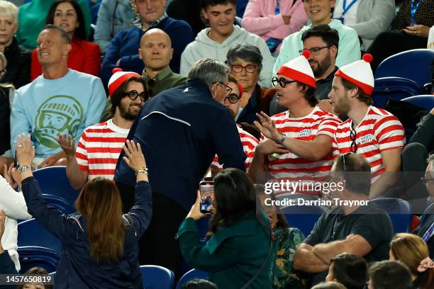 Fans in the crowd dressed up in 'Where's Wally?' costumes are seen during the round two singles match between Novak Djokovic of Serbia and Enzo...