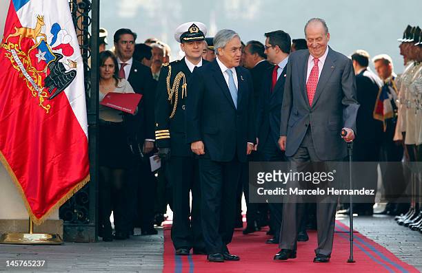 King Juan Carlos of Spain and the President of Chile Sebastián Piñera walk into the Presidential Palace La Moneda on June 5, 2012 in Santiago, Chile.