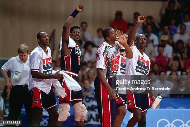 Clyde Drexler, Patrick Ewing, Magic Johnson, Michael Jordan of the United States celebrate against Croatia during the Gold Medal Basketball game at...