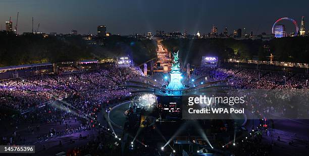 Crowds gather in the Mall for the Diamond Jubilee, Buckingham Palace Concert on June 04, 2012 in London, England. For only the second time in it's...