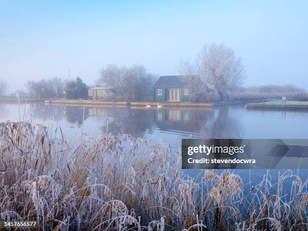 a winters river view, taken on the banks of the norfolk broads national park at thurne. - norfolk broads stock pictures, royalty-free photos & images