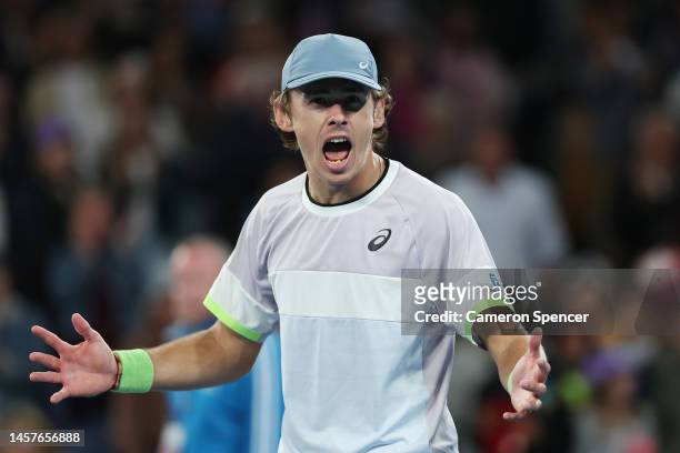 Alex de Minaur of Australia celebrates afterwinning match point in their round two singles match against Adrian Mannarino of France during day four...
