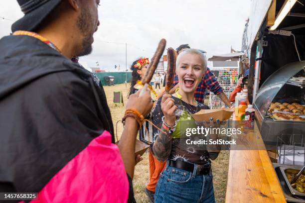 sausage on a stick! - food festival imagens e fotografias de stock