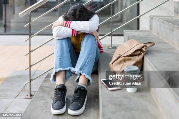 anxious teenage student worried about school bullying - kids invasion stock pictures, royalty-free photos & images