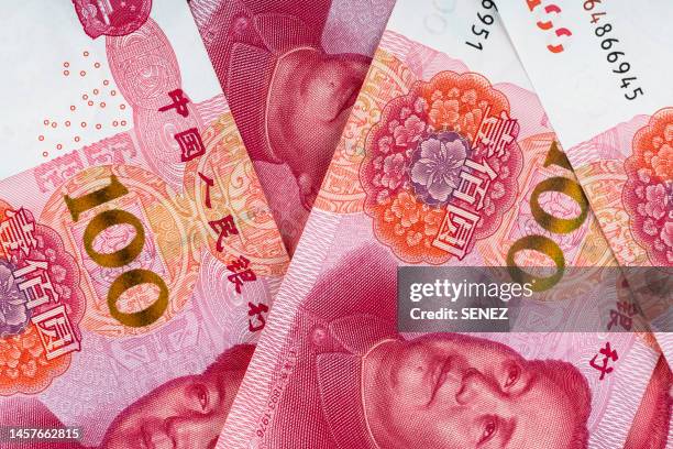 chinese cny money in 100 rmb bills - chinese currency stock pictures, royalty-free photos & images