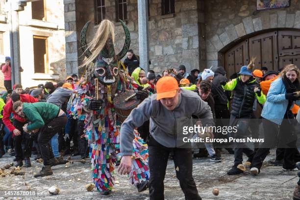 Several residents of the municipality throw turnips to a costumed character in the festival of 'Jarramplas', on 19 January, 2023 in Piornal, Caceres,...