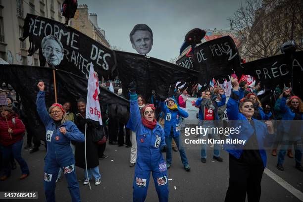Protestors march through the streets of Paris as part of nationwide protest and strike against President Macron's Pension reform plans and the rising...