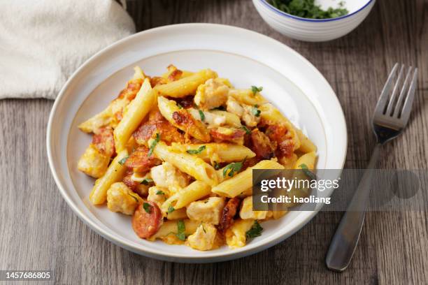 chorizo, chicken pasta bake - chorizo stock pictures, royalty-free photos & images