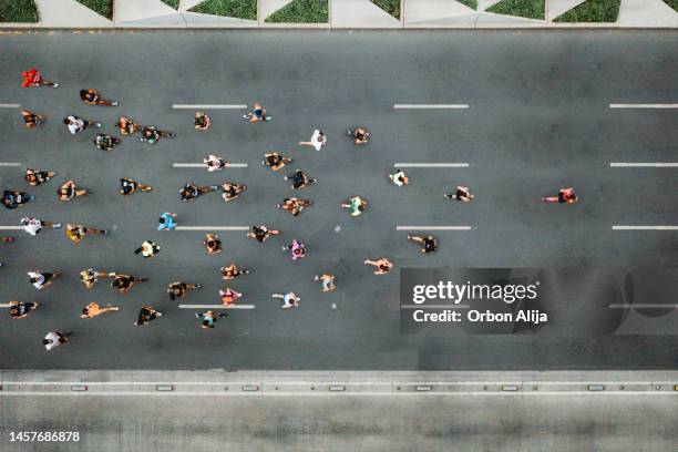 one person leading marathon - people in crowd street imagens e fotografias de stock