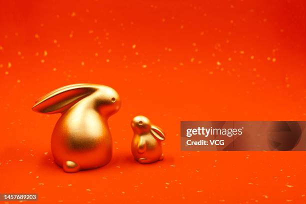 In this photo illustration shows a golden rabbit with a smaller golden rabbit on November 2022 in China. The Chinese New Year in 2023 will be the...