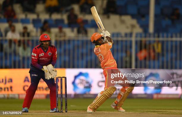 Rehan Ahmed of Gulf Giants hits out watched by Robin Uthappa in the DP World ILT20 match between Gulf Giants and Dubai Capitals at Sharjah Cricket...