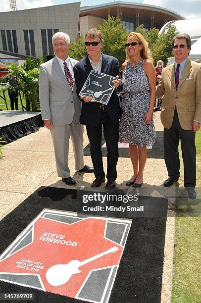 Bob Fisher, Steve Winwood, Eugenia Winwood and Mark Stengel attend the Music City Walk of Fame Induction of Steve Winwood and Bob Babbitt at Walk of...