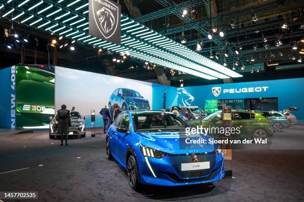 Peugeot e-208 electric compact hatchback car at the Peugeot motor show stand at Brussels Expo on January 13, 2023 in Brussels, Belgium.