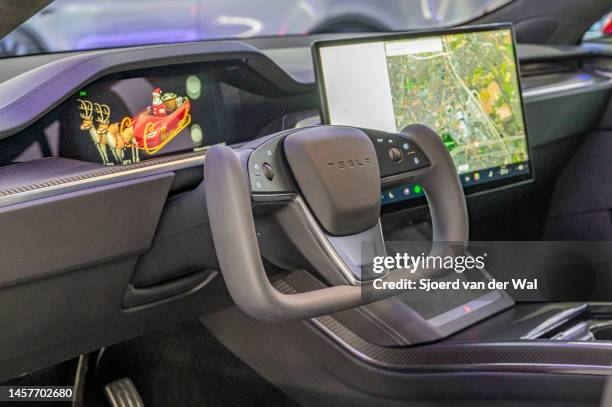 Tesla Model S full electric sedan interior with the yoke steering wheel at Brussels Expo on January 13, 2023 in Brussels, Belgium.