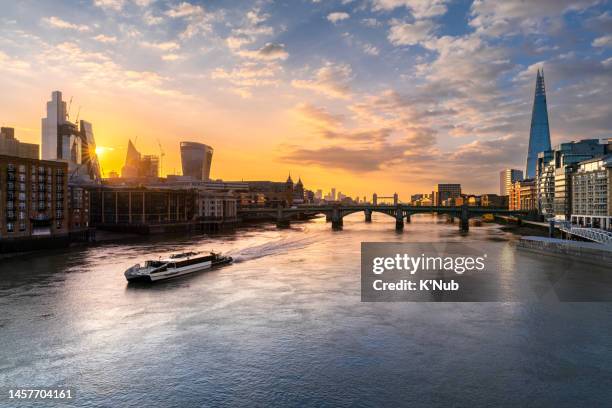 beautiful sunrise cityscape or landscape view of the shard tower, tower bridge and skyscraper of london downtown along with boat cruise in thames river center of london, great britain in england or united kingdom - kingdom of england stock pictures, royalty-free photos & images