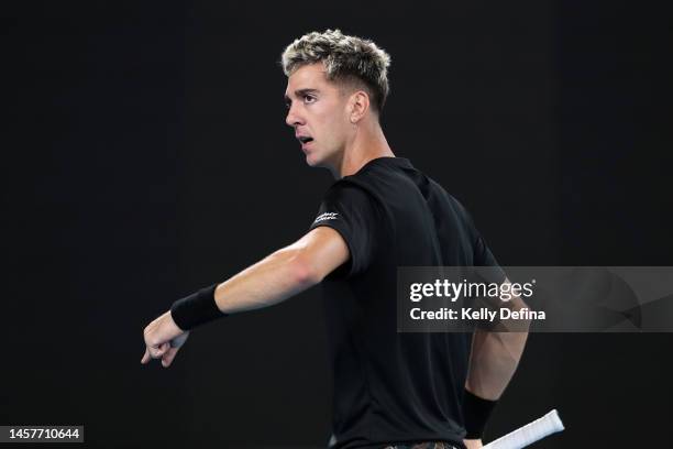 Thanasi Kokkinakis of Australia reacts in their round two singles match against Andy Murray of Great Britain during day four of the 2023 Australian...