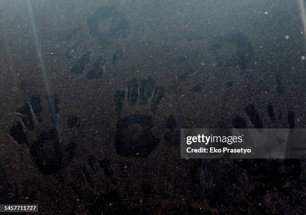 handprints in the dust on the glass - hand print stock pictures, royalty-free photos & images