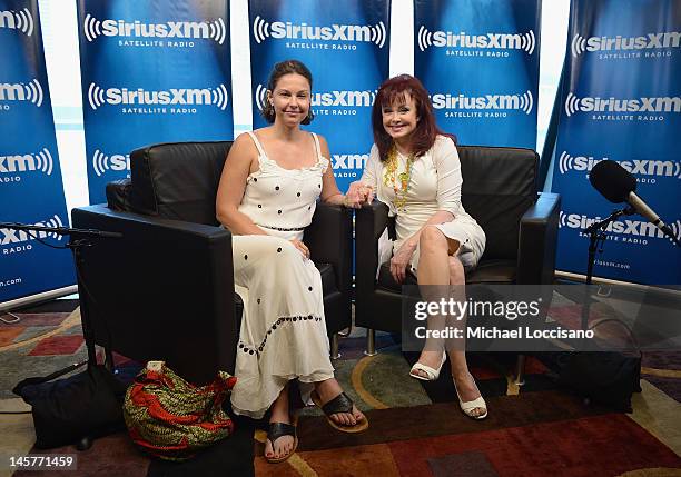 Actress Ashley Judd and mother, singer Naomi Judd pose following the launch of Naomi's SiriusXM series "Think Twice" at SiriusXM Music City Theater...