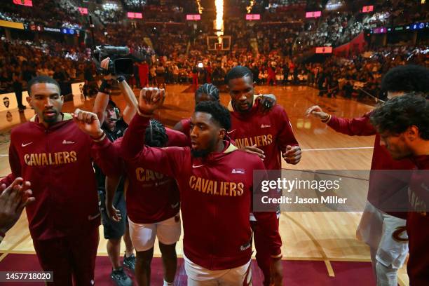 Donovan Mitchell of the Cleveland Cavaliers leads his teammates in the huddle during player introductions prior to the game against the Washington...