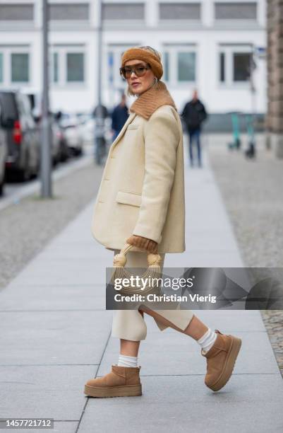 Tina Haase wears Frankie Shop vanilla beige blazer, &other stories brown Cardigan, Selected Femme knit top and skirt, UGG mini boots, Jacquemus brown...