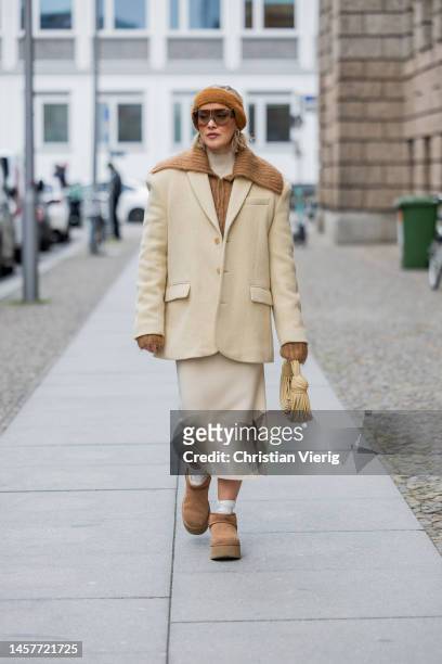 Tina Haase wears Frankie Shop vanilla beige blazer, &other stories brown Cardigan, Selected Femme knit top and skirt, UGG mini boots, Jacquemus brown...