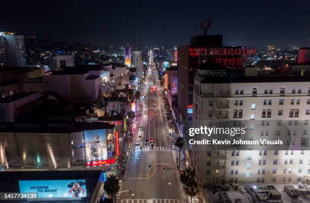 aerial view above hollywood boulevard with the roosevelt hotel on the right at night - hollywood california fotografías e imágenes de stock