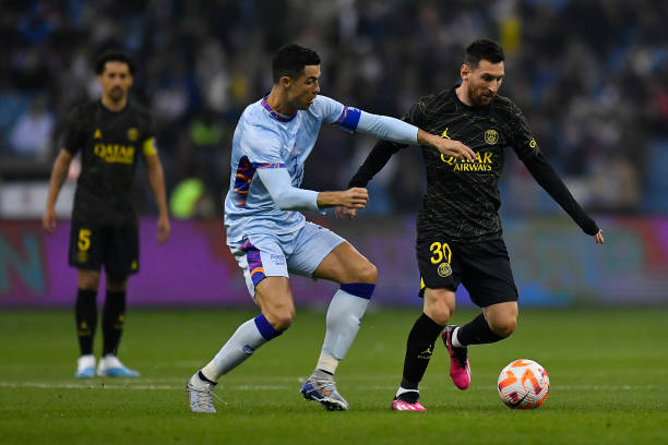 Leo Messi of Paris Saint-Germain and Cristiano Ronaldo of Ruyadh XI fight for possession during the friendly match between Paris Saint-Germain and...