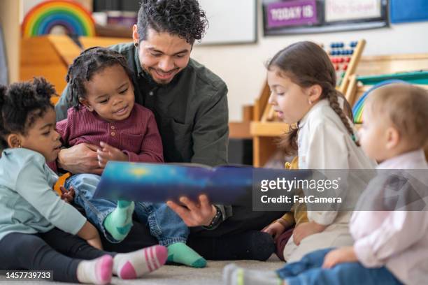 story time at daycare - story stock pictures, royalty-free photos & images