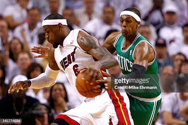 Rajon Rondo of the Boston Celtics attempts to steal the ball from LeBron James of the Miami Heat in the first half of Game Five of the Eastern...