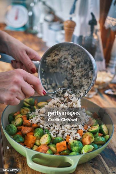 preparing farmers harvest chicken casserole - wild rice stock pictures, royalty-free photos & images