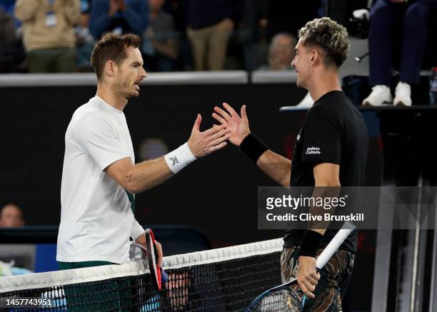 Andy Murray of Great Britain shakes hands at the net after his five set victory in their round two singles match against Thanasi Kokkinakis of...