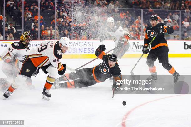 Owen Tippett of the Philadelphia Flyers reaches for the puck against the Anaheim Ducks at Wells Fargo Center on January 17, 2023 in Philadelphia,...