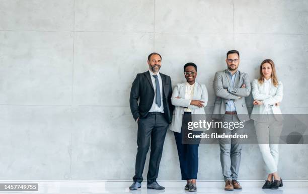 portrait of business team - standing together stock pictures, royalty-free photos & images