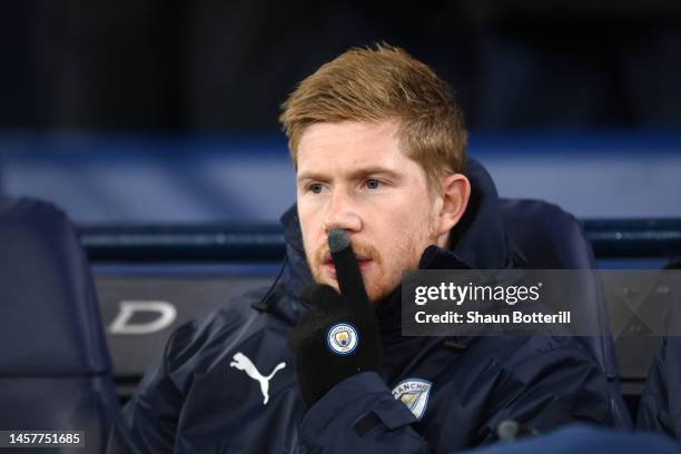 Kevin De Bruyne of Manchester City looks on from the bench prior to the Premier League match between Manchester City and Tottenham Hotspur at Etihad...