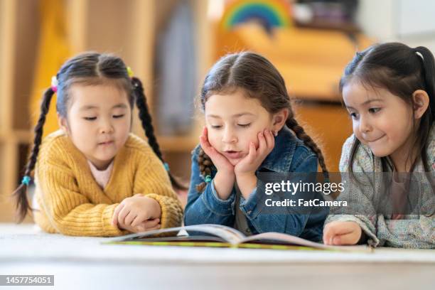 reading buddies - reading script stock pictures, royalty-free photos & images