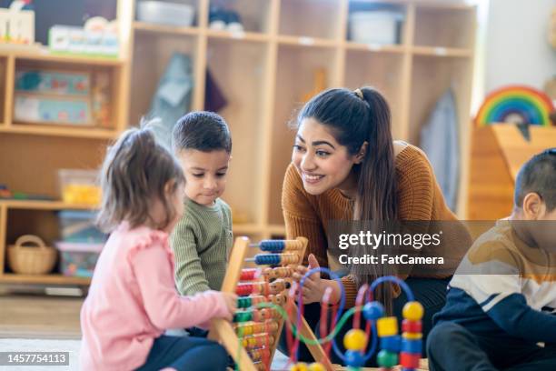 learning through play - teacher and child stock pictures, royalty-free photos & images