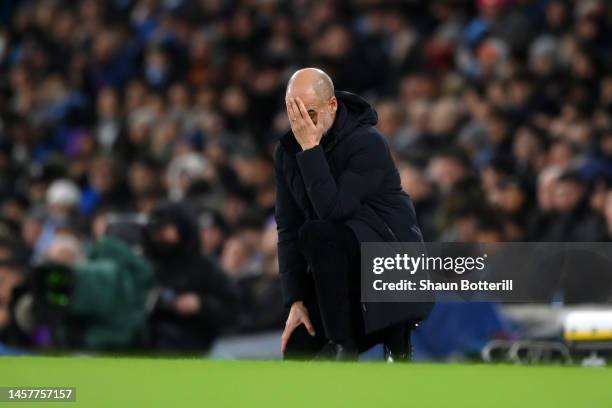 Pep Guardiola, Manager of Manchester City, reacts during the Premier League match between Manchester City and Tottenham Hotspur at Etihad Stadium on...