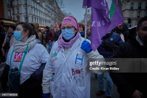 Hospital worker march through central Paris as over 400,000 people take the streets of the French capital to demonstrate against President Macron's...