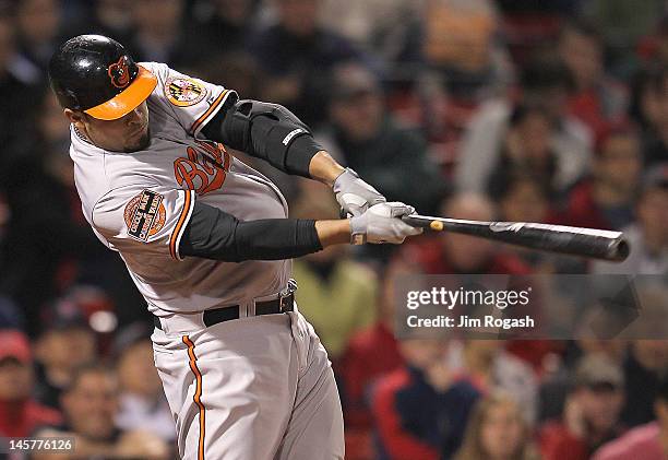 Ronny Paulino of the Baltimore Orioles knocks in the seventh and winning run in the ninth inning against the Boston Red Sox at Fenway Park June 5,...