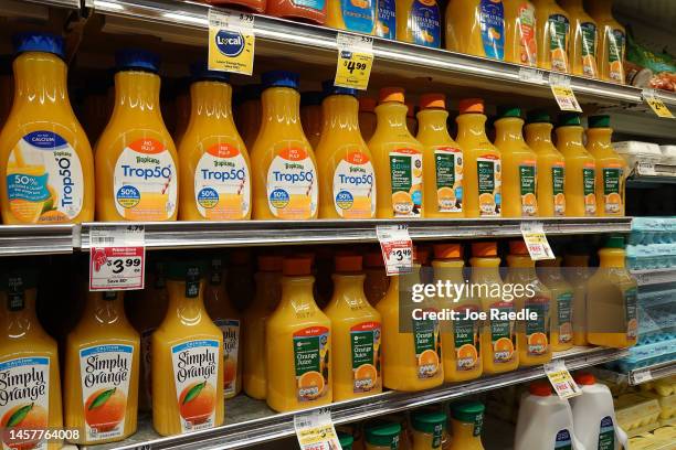 Containers of orange juice are on display in a grocery store on January 19, 2023 in Miami, Florida. Orange juice has become expensive as Florida...