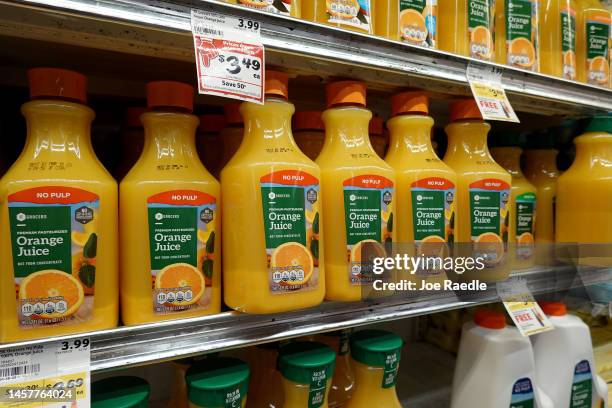 Containers of orange juice are on display in a grocery store on January 19, 2023 in Miami, Florida. Orange juice has become expensive as Florida...