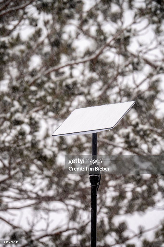 Starlink Antenna Dish Mounted To A Pole Falling Snow Melts Off The starlink-antenna-dish-mounted-to-a-pole-falling-snow-melts-off-the