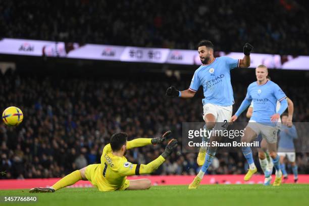 Riyad Mahrez of Manchester City scores their sides fourth goal past Hugo Lloris of Tottenham Hotspur during the Premier League match between...