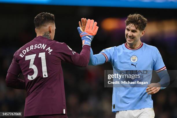 Ederson and John Stones of Manchester City celebrate after Riyad Mahrez of Manchester City scores their sides fourth goal during the Premier League...